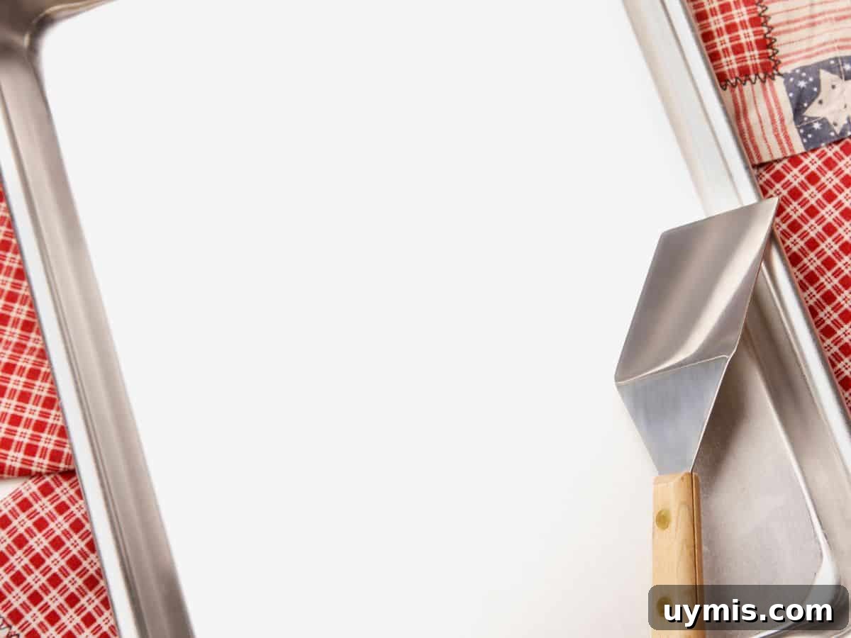 Aluminum baking sheet lined for cookies.