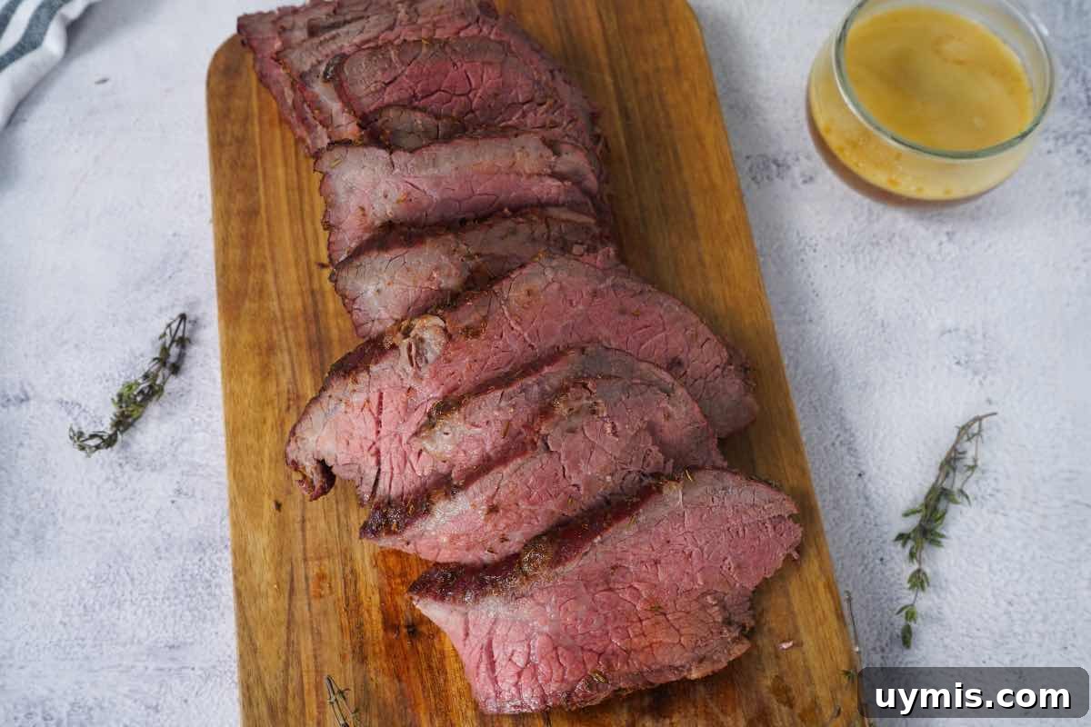 Smoked Rump Roast with Thyme Rub 8 Smoked rump roast sliced with sprigs of thyme.