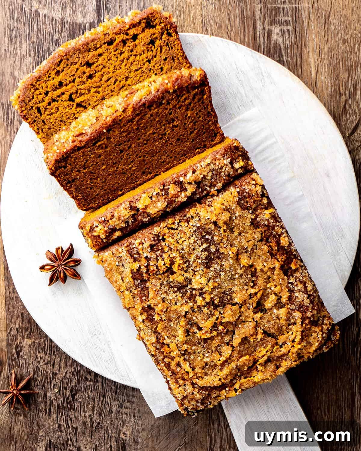 Moist Pumpkin Bread Recipe with Warm Spices 7 a loaf of Healthy Pumpkin Bread with 3 slices cut out of it