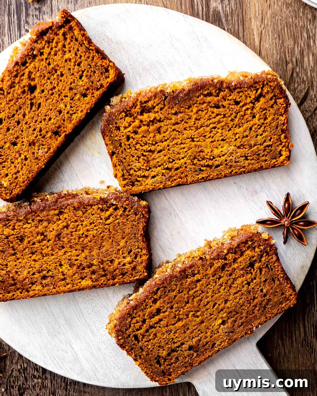 Moist Pumpkin Bread Recipe with Warm Spices 8 4 slices of Healthy Pumpkin Bread on a serving plate