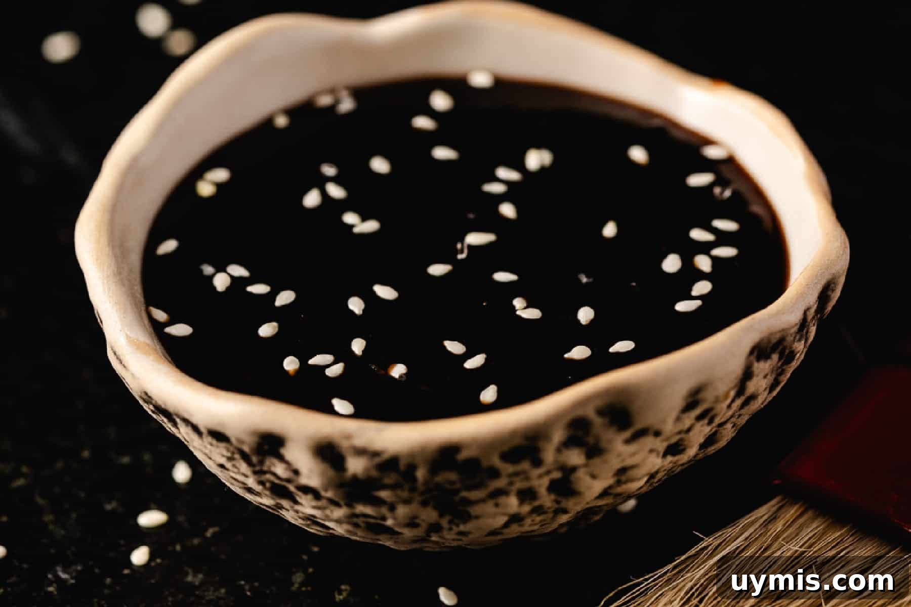 Homemade Korean BBQ Sauce Recipe 5 Korean BBQ sauce in white bowl with sesame seeds on top.