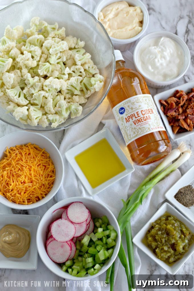 Ingredients to make Low Carb Cauliflower Salad on a marble counter
