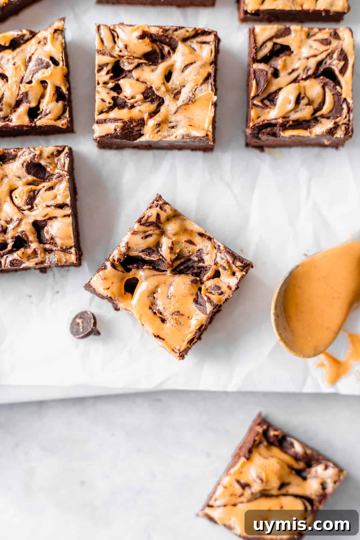 Peanut Butter Chocolate Cream Cheese Fudge Recipe 2 Peanut butter swirl cream cheese fudge on wax paper.