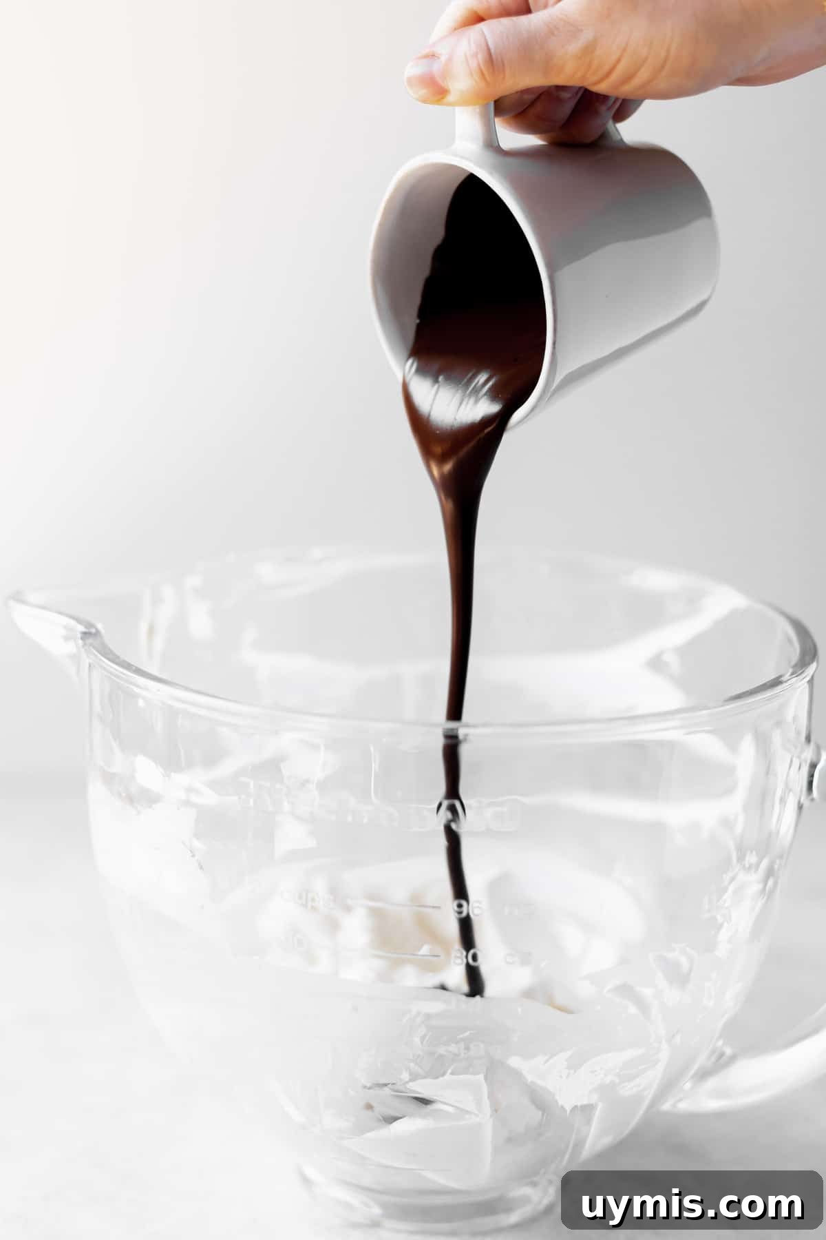 Peanut Butter Chocolate Cream Cheese Fudge Recipe 3 Pouring melted chocolate into cream cheese.