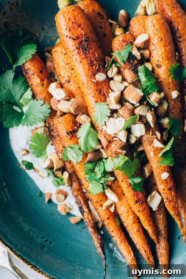 Black Pepper Roasted Carrots with Cilantro Yogurt and Almonds 4 Black pepper roasted carrots with cilantro yogurt and toasted almonds ready to serve.