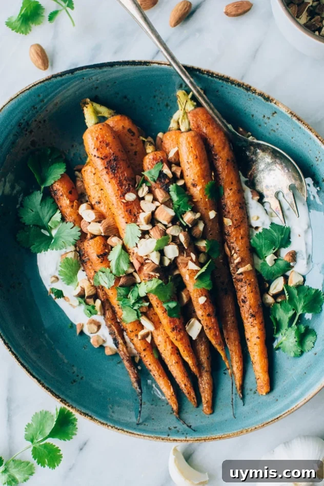 Roasted carrots with a savory cilantro yogurt sauce and chopped almonds.