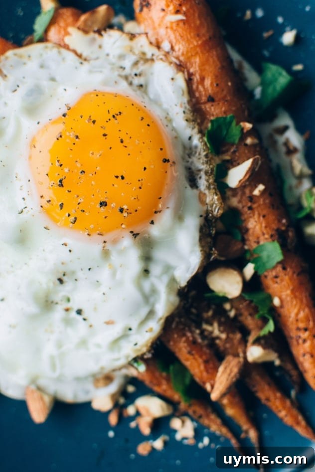 Black pepper roasted carrots served with cilantro yogurt, toasted almonds, and an optional fried egg.