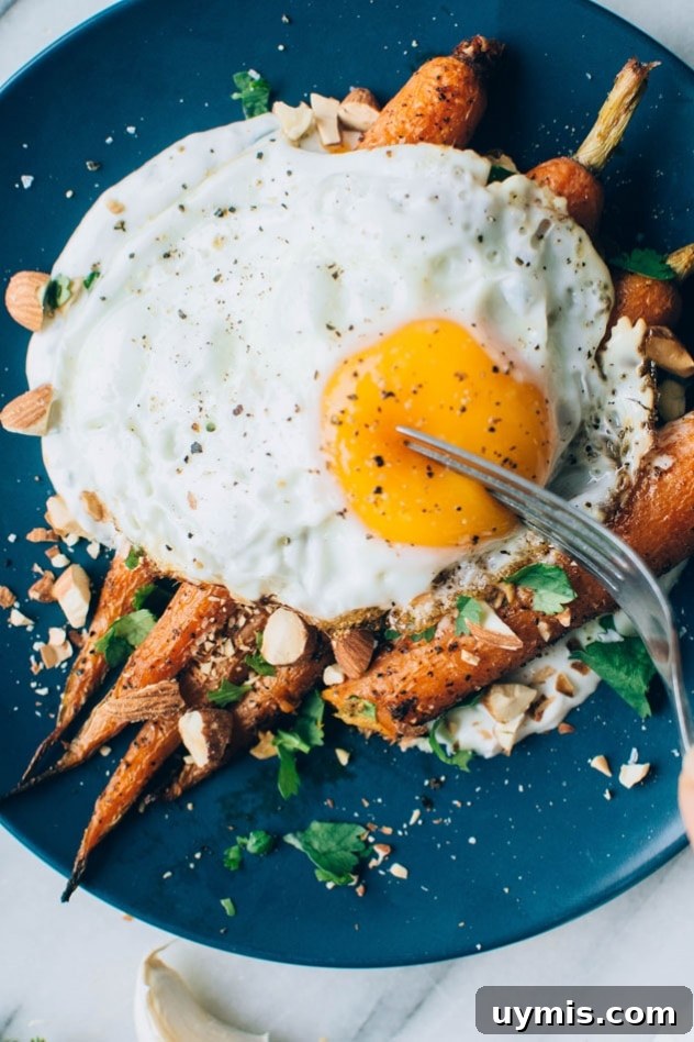 Black Pepper Roasted Carrots with Cilantro Yogurt and Almonds 8 Roasted carrots with savory cilantro yogurt, almonds, and a fried egg for a simple meal.