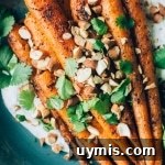 Black pepper roasted carrots with cilantro yogurt and toasted almonds.