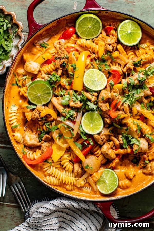 Caprese Grilled Chicken with Herb Roasted Potatoes 12 chicken fajita pasta in a large skillet topped with cilantro and sliced limes.