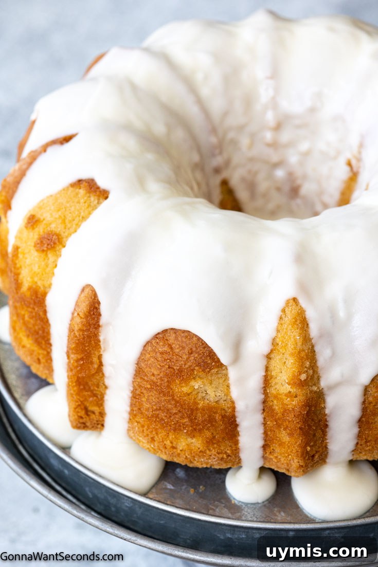 Glazed buttermilk pound cake on a cake stand buttermilk pound cake with glaze on a cake stand