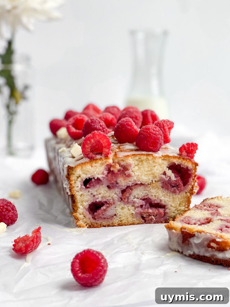 White Chocolate Raspberry Loaf Cake 2 raspberry white chocolate loaf cake cut so you can see inside.