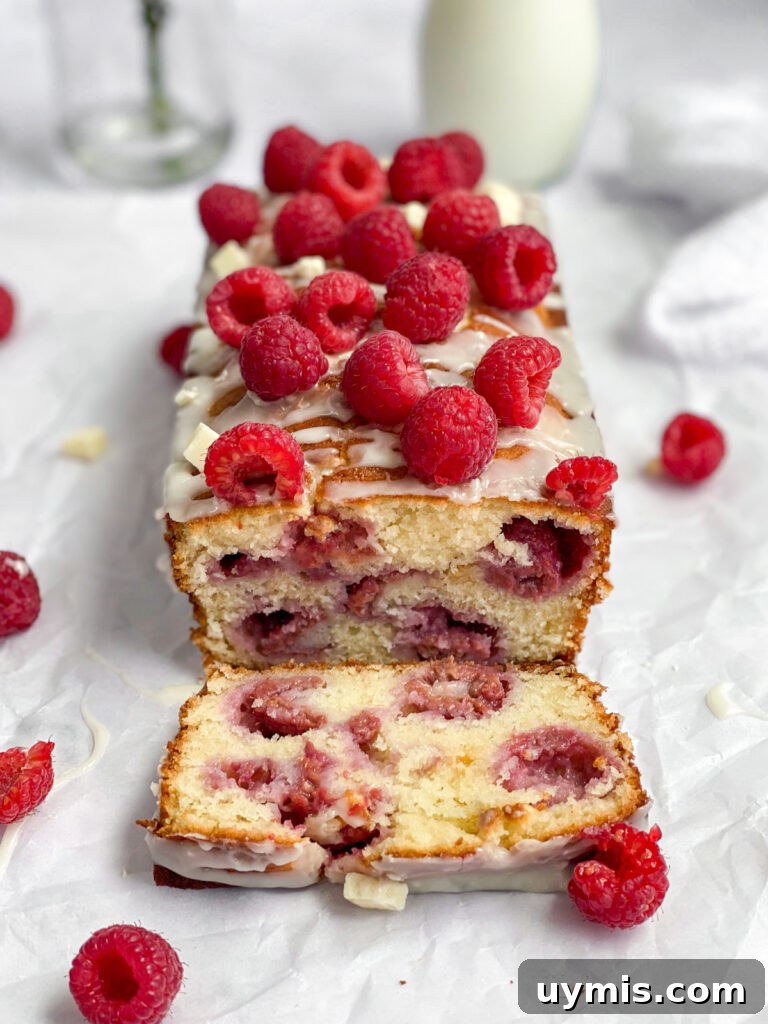 White Chocolate Raspberry Loaf Cake 15 one slice cut from the raspberry white chocolate loaf cake so you can see the inside.