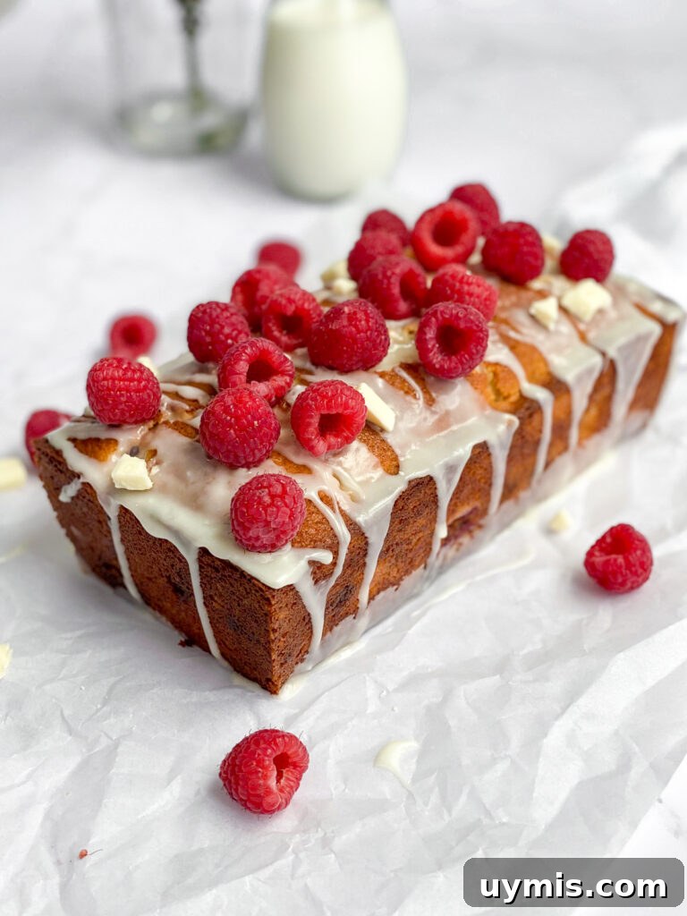 White Chocolate Raspberry Loaf Cake 3 the whole raspberry white chocolate loaf cake topped with fresh raspberries.