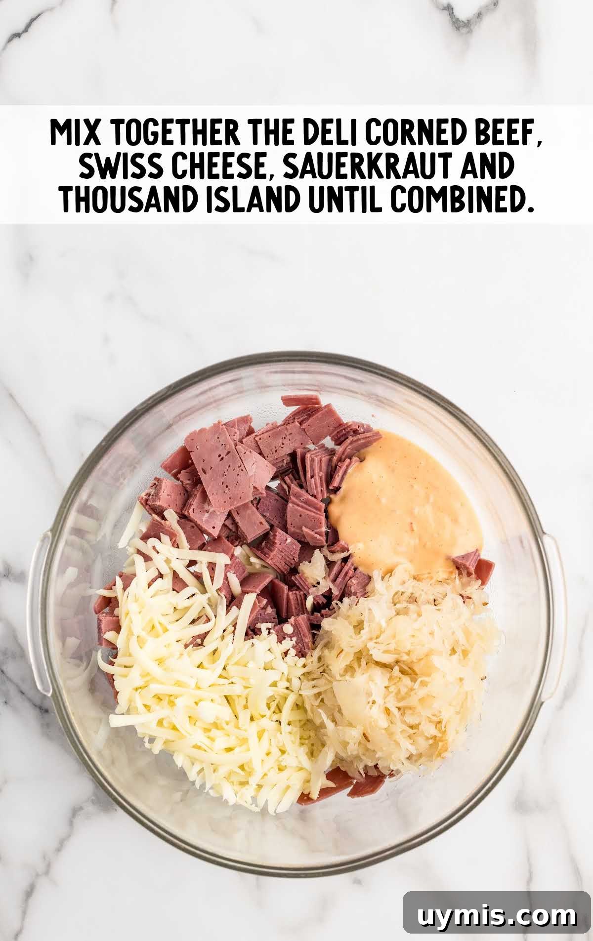 corned beef, shredded Swiss cheese, drained sauerkraut, and thousand island dressing mixed together in a bowl