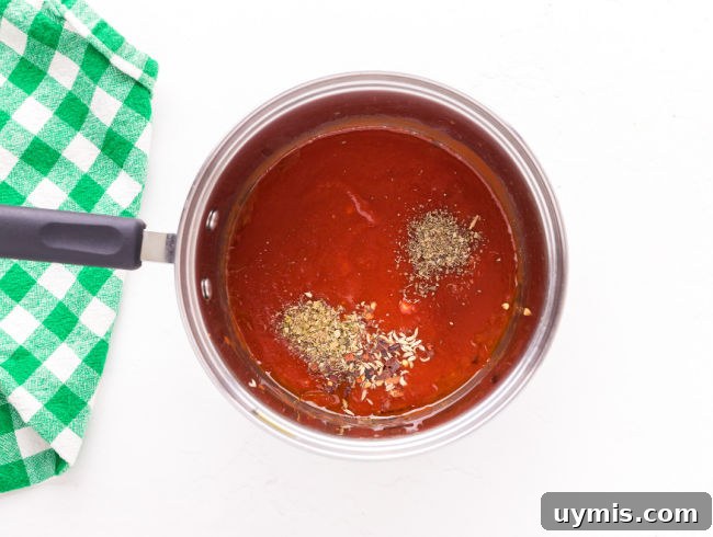 Homemade Pizza Sauce Recipe Without Tomato Paste 5 Tomato sauce and spices in a saucepan.