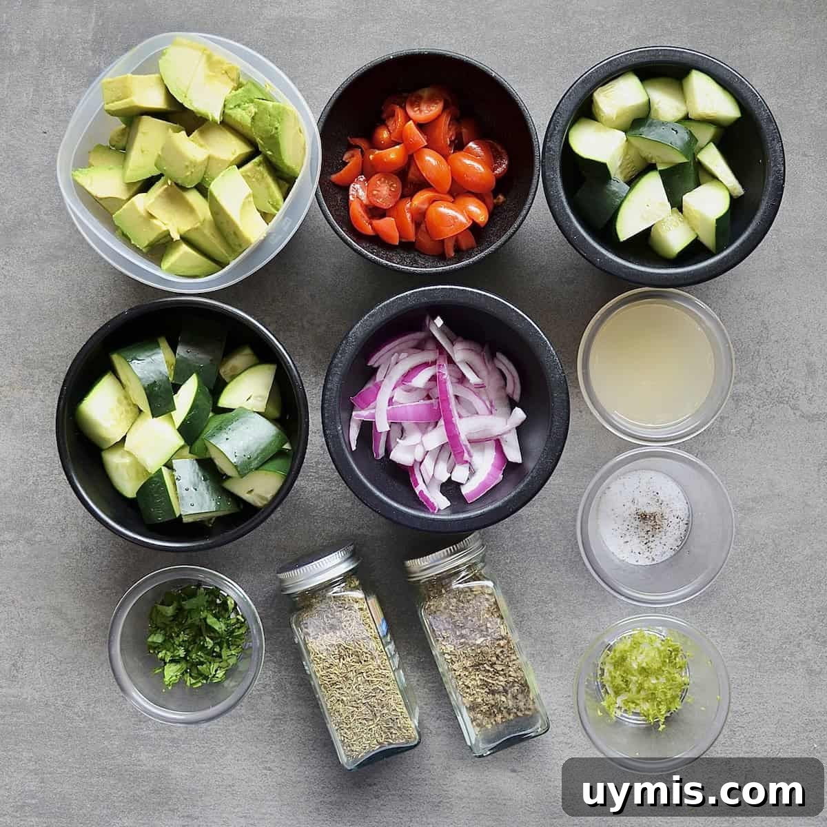 Measured ingredients for salad with cucumbers and avocado