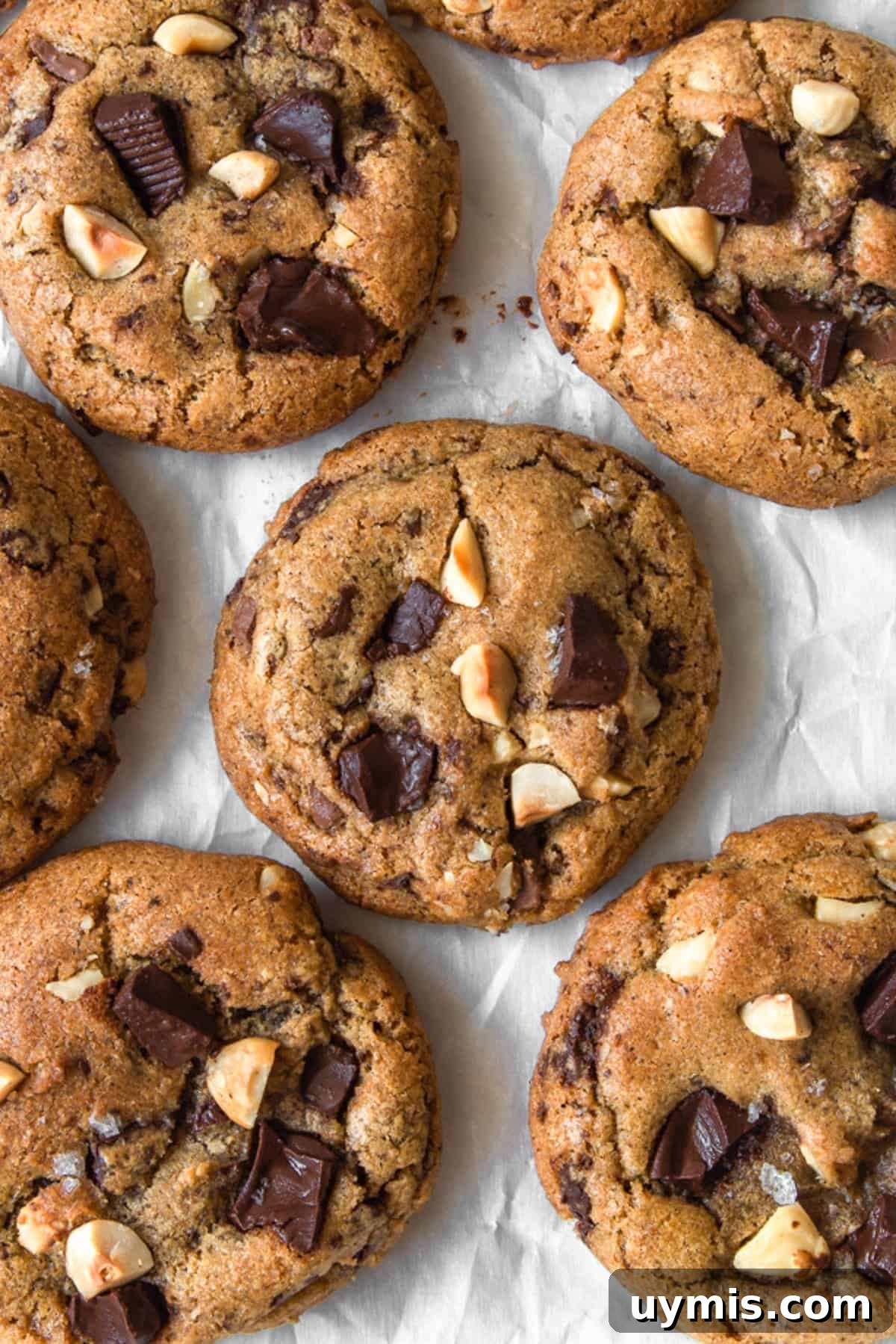 Chewy Brown Butter Chocolate Chip Cookies 3 Overhead shot of browned butter chocolate chip cookies on parchment paper.