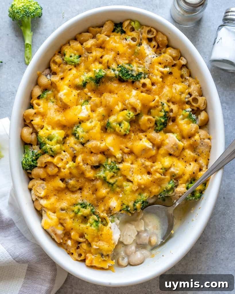Creamy Broccoli Chicken Pasta Casserole 6 top view of broccoli chicken casserole with spoon in it.