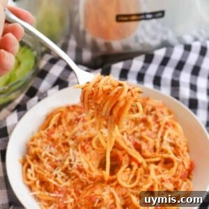 Slow Cooker Creamy Tomato Chicken Spaghetti on a fork