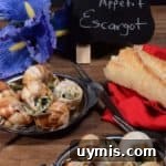 A dozen French escargot in a garlic butter sauce