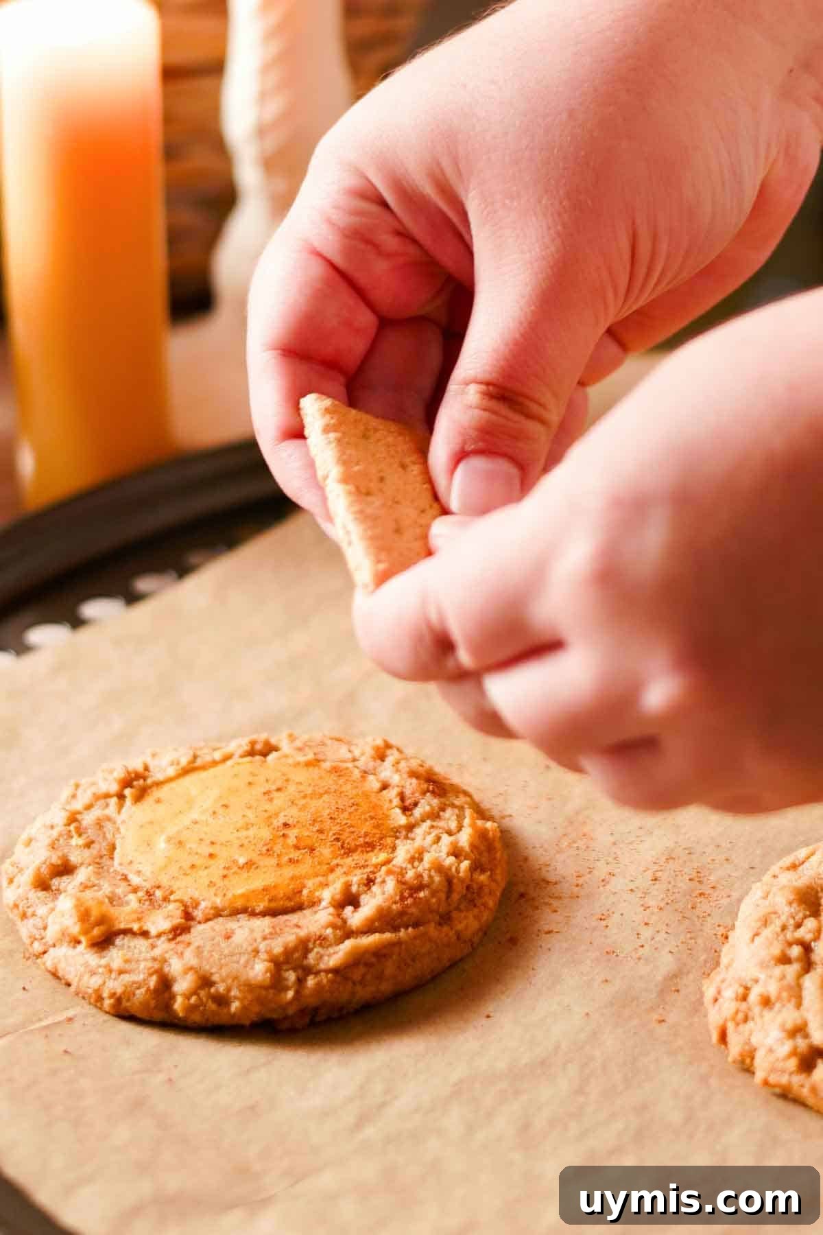 Soft Pumpkin Cheesecake Cookies with Cream Cheese Swirl 11 topping cookies with pieces of graham crackers