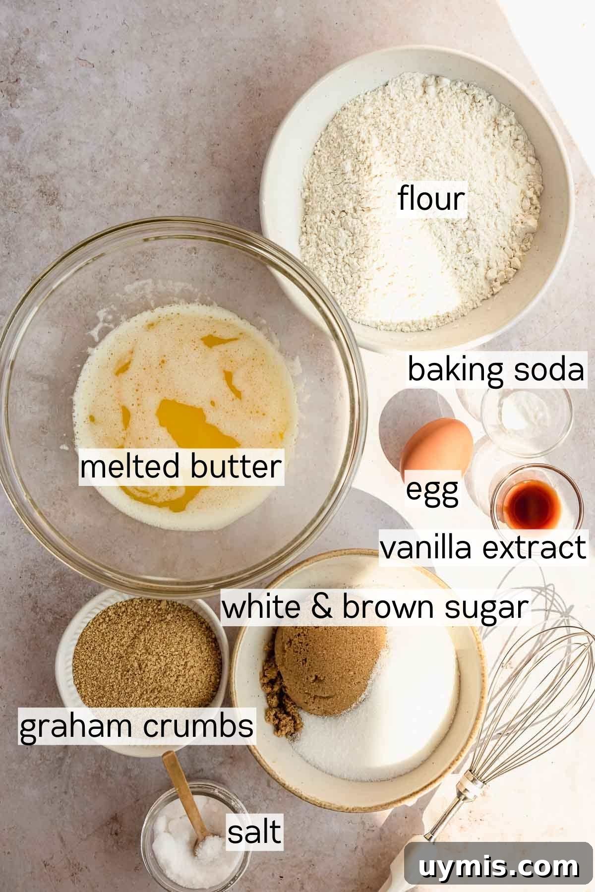 Soft Pumpkin Cheesecake Cookies with Cream Cheese Swirl 3 flour, melted butter, baking soda, egg, vanilla extract, white and brown sugar, graham crumbs, and salt in bowls