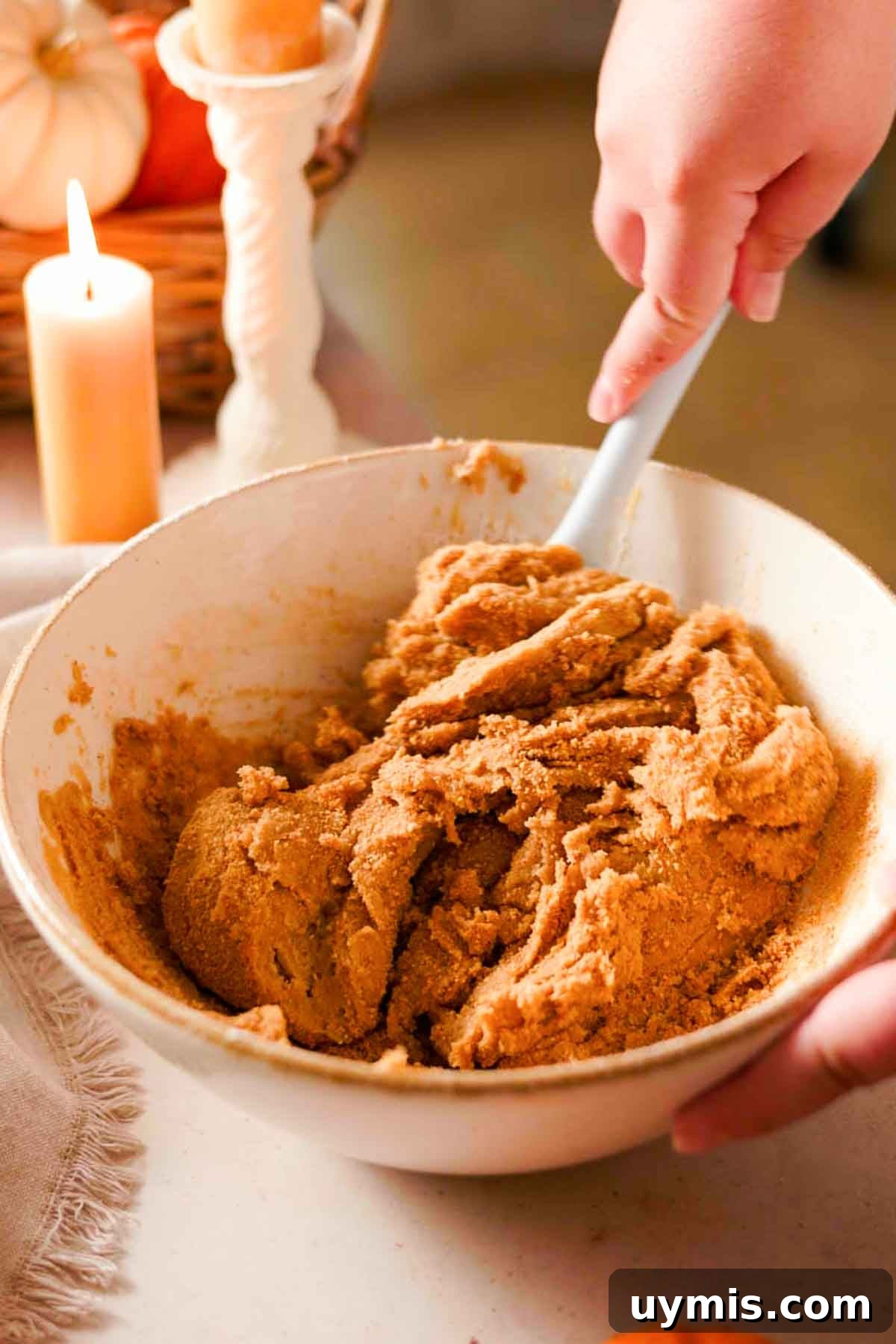 Soft Pumpkin Cheesecake Cookies with Cream Cheese Swirl 7 folding graham cracker crumbs into cookie dough with a rubber spatula