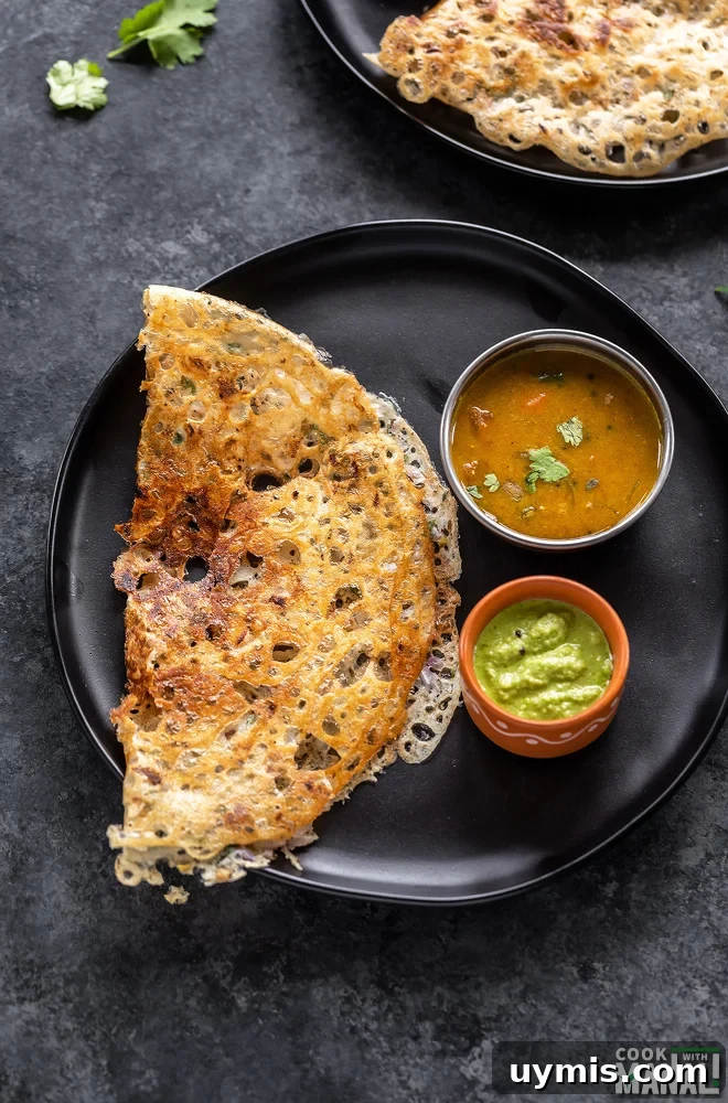 Rava dosa plated with sambar and chutney