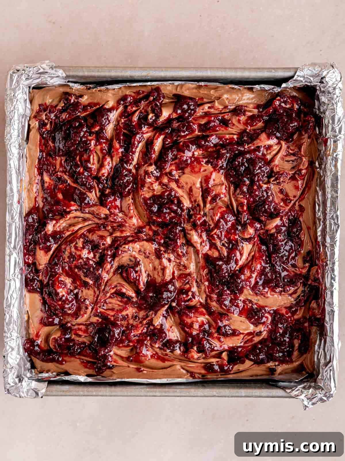 Creamy No-Bake Chocolate Cherry Cheesecake Recipe 13 Cherry topping swirled over a no bake chocolate cheesecake with an Oreo crust.