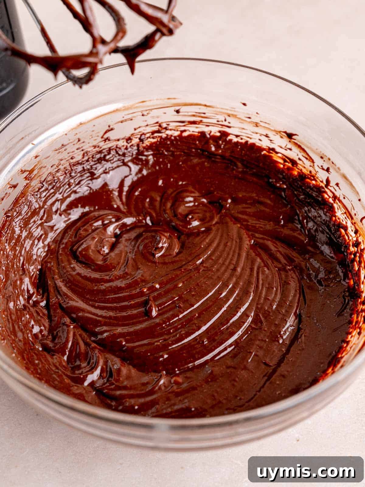 Creamy No-Bake Chocolate Cherry Cheesecake Recipe 10 Chocolate ganache mixed with a hand mixer.