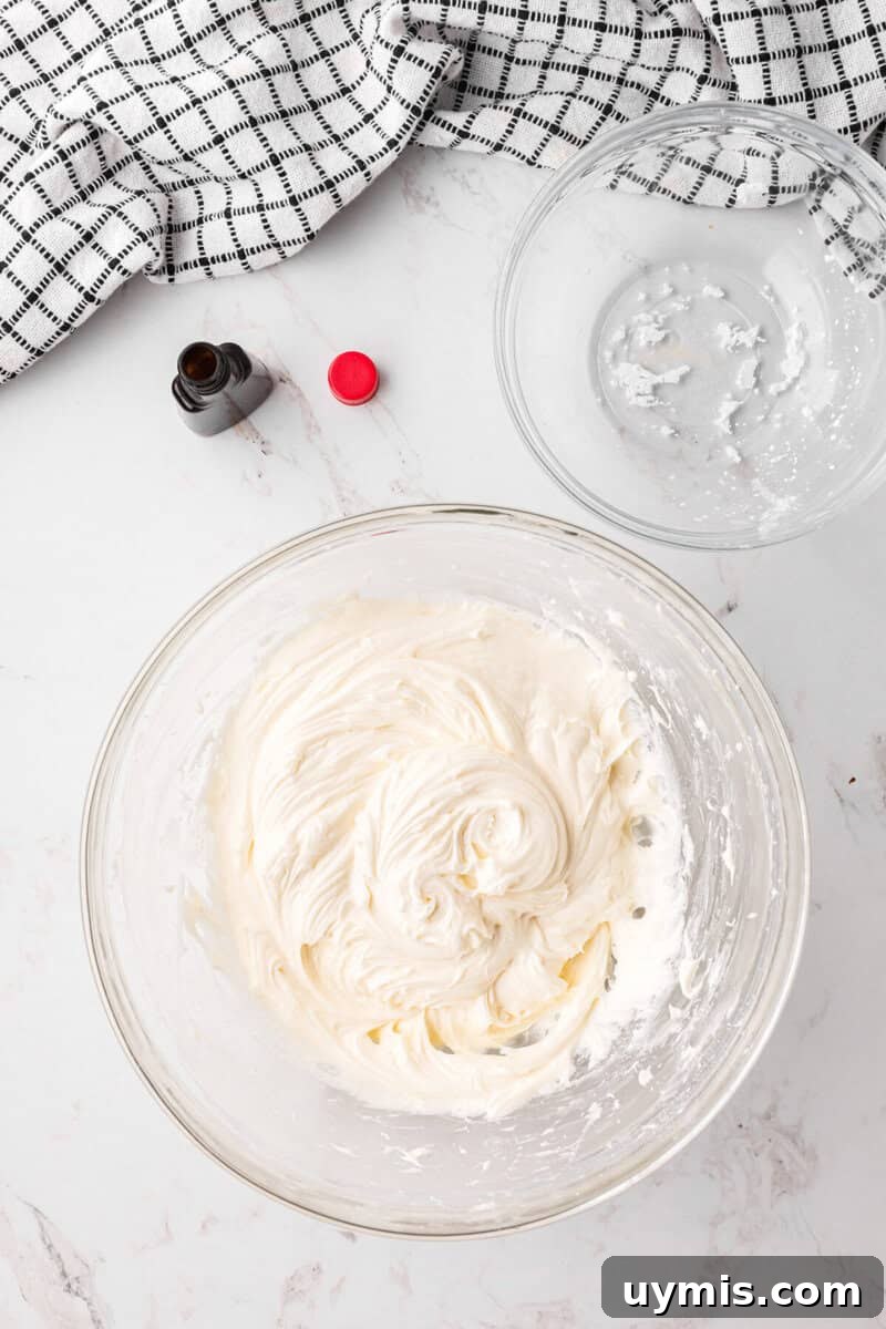 Moist Pumpkin Cupcakes with Cinnamon Cream Cheese Frosting 12 frosting in a large clear bowl.