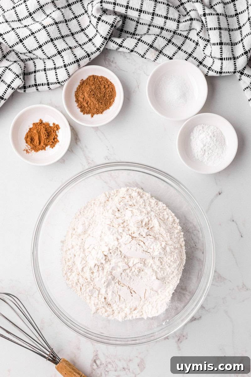 Moist Pumpkin Cupcakes with Cinnamon Cream Cheese Frosting 5 mixing the dry ingredients for the cupcake batter.