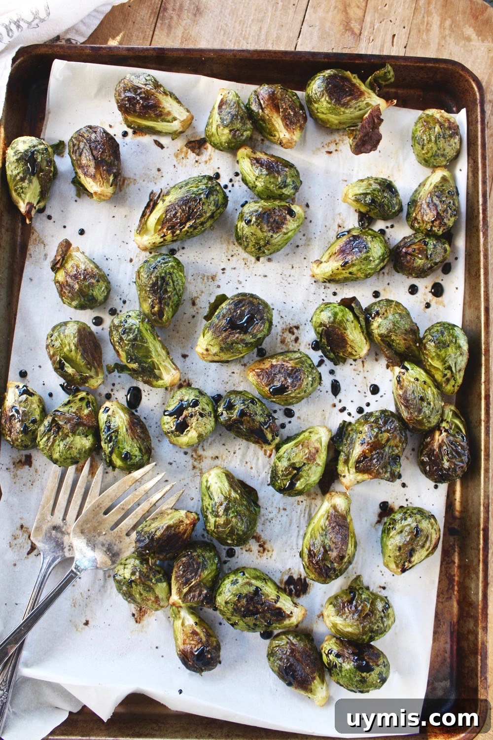 Whole Roasted Brussels Sprouts with Balsamic Glaze 4 Roasted Brussels sprouts on a baking sheet