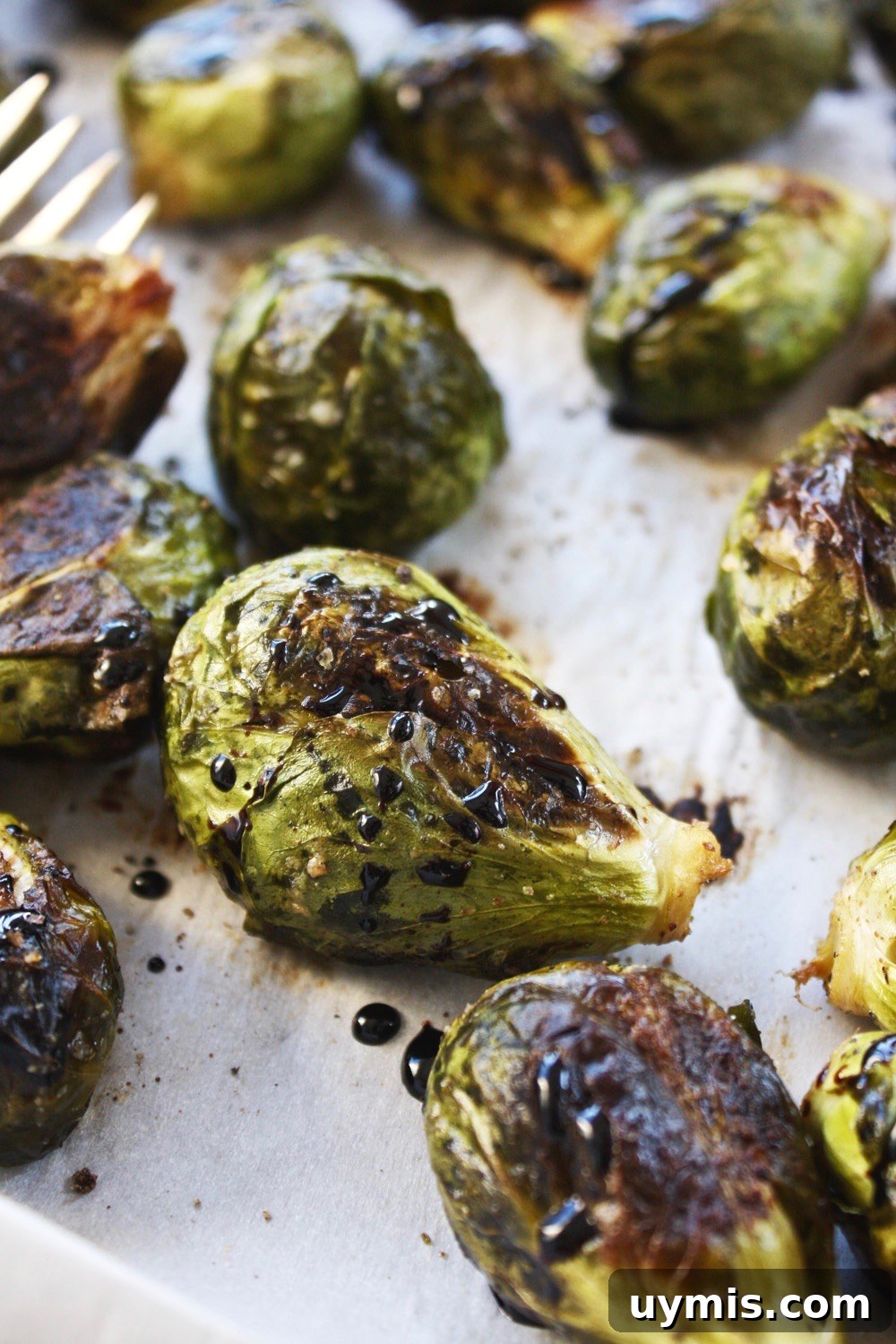 Whole Roasted Brussels Sprouts with Balsamic Glaze 5 Whole roasted Brussels sprouts drizzled with balsamic reduction