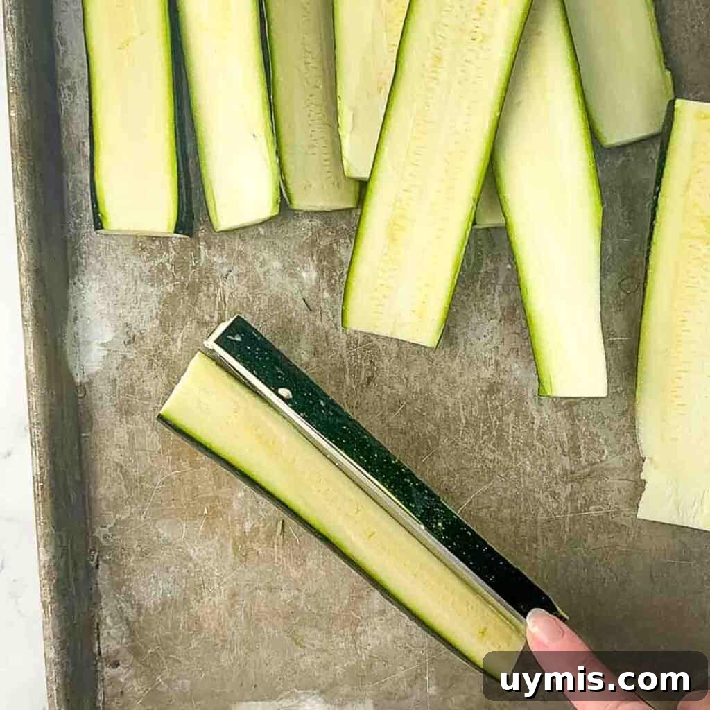 How to Smoke Zucchini on a Pellet Grill 4 Preparing the zucchini by slicing each one lengthwise and then in half again, aiming for ¼-inch thick slices.