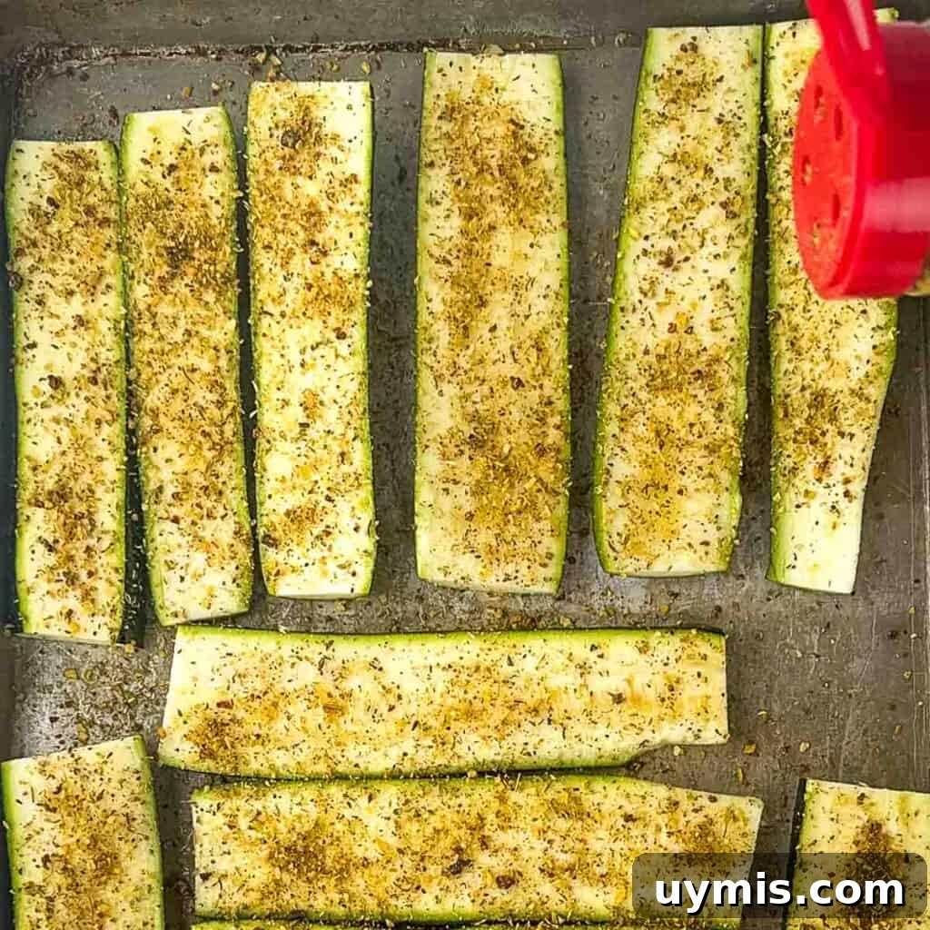 How to Smoke Zucchini on a Pellet Grill 6 Sprinkling Greek seasoning generously over the zucchini slices.