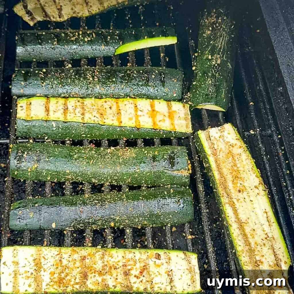 How to Smoke Zucchini on a Pellet Grill 8 The smoked zucchini on the grill at the end of the smoking time, fork-tender with a bit of char.