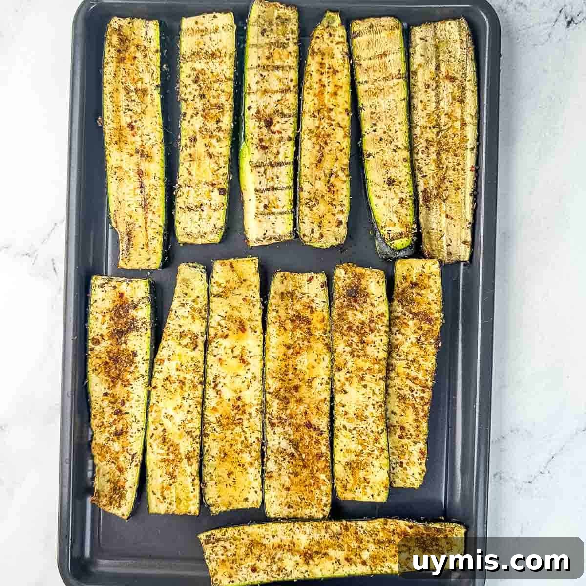 How to Smoke Zucchini on a Pellet Grill 9 The smoked zucchini slices on a baking sheet, ready to serve.