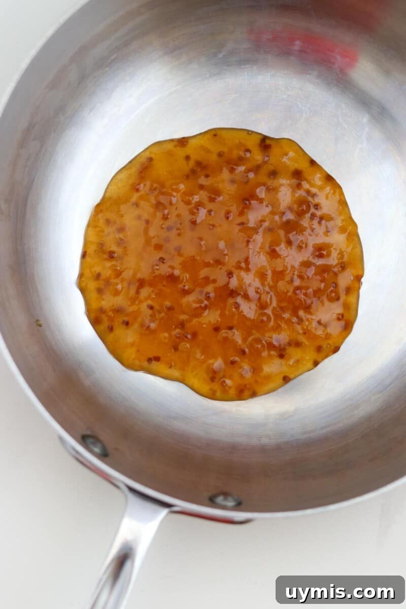 Multekrem: Norwegian Cloudberry Cream Recipe 4 Cloudberry preserves in a saucepan.