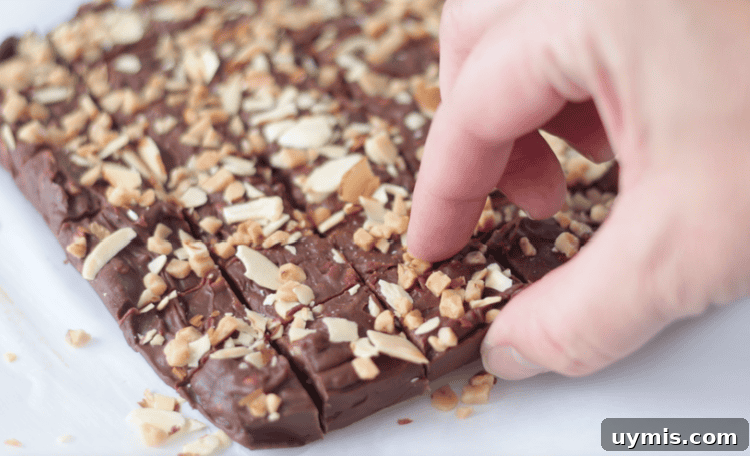 hand picking up square of 5 minute fudge