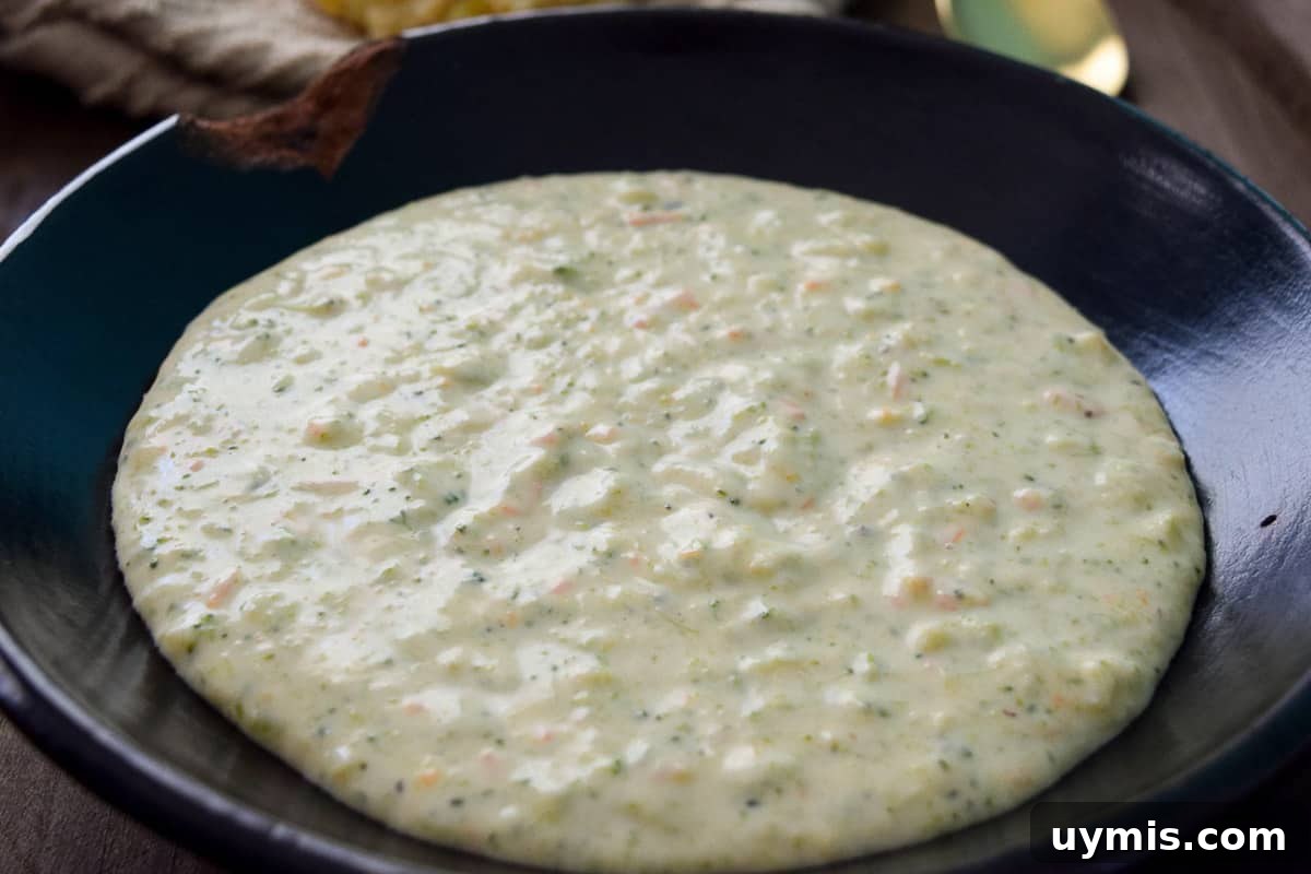 Creamy Homemade Broccoli Cheddar Soup Recipe 3 Broccoli Cheddar Soup in black bowl up close view