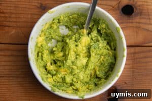 Hot Honey Avocado Toast Recipe 9 This is a picture of a bowl with smashed avocado.