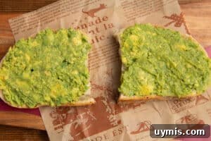Hot Honey Avocado Toast Recipe 10 This is a picture of the toast with avocado spread.