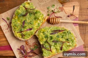 Hot Honey Avocado Toast Recipe 11 This is a picture of the toast with avocado spread and hot honey.