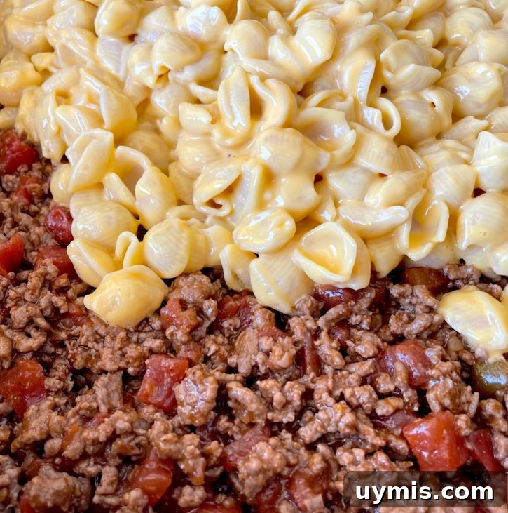 Taco Macaroni and Cheese Skillet Dinner 7 Finished taco macaroni and cheese mixed together in a skillet.