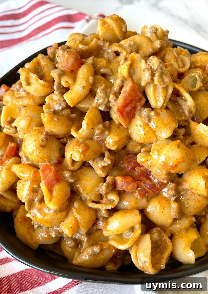 Taco Macaroni and Cheese Skillet Dinner 9 Budget-friendly taco macaroni and cheese made with ground beef for an easy weeknight dinner.