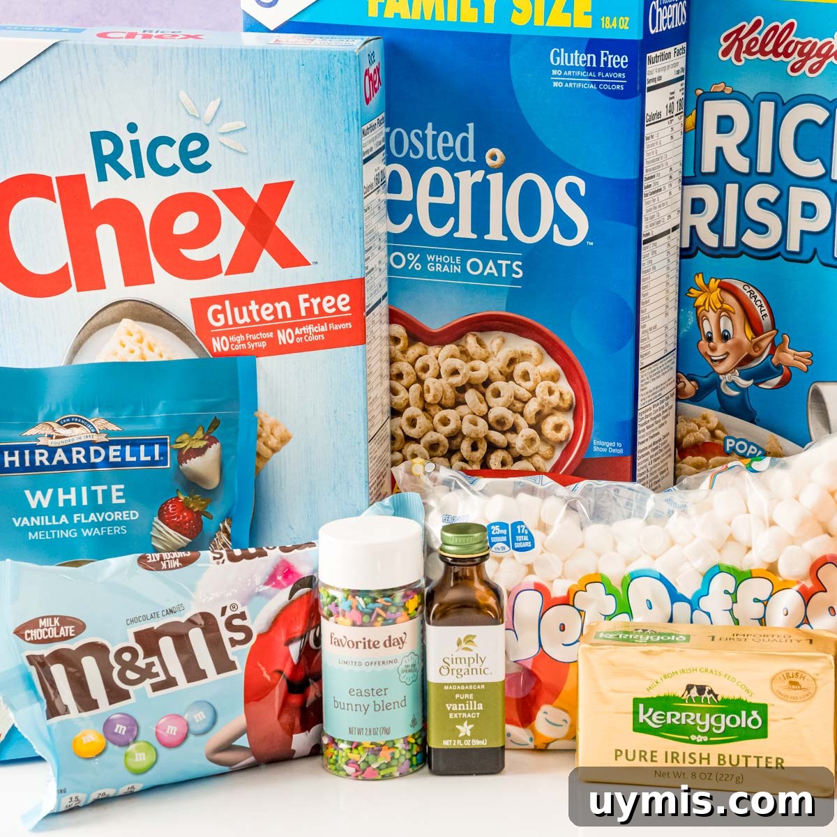 Egg Shaped Rice Krispie Treats for Easter 4 Ingredients to make easter rice krispie treats on a white table.