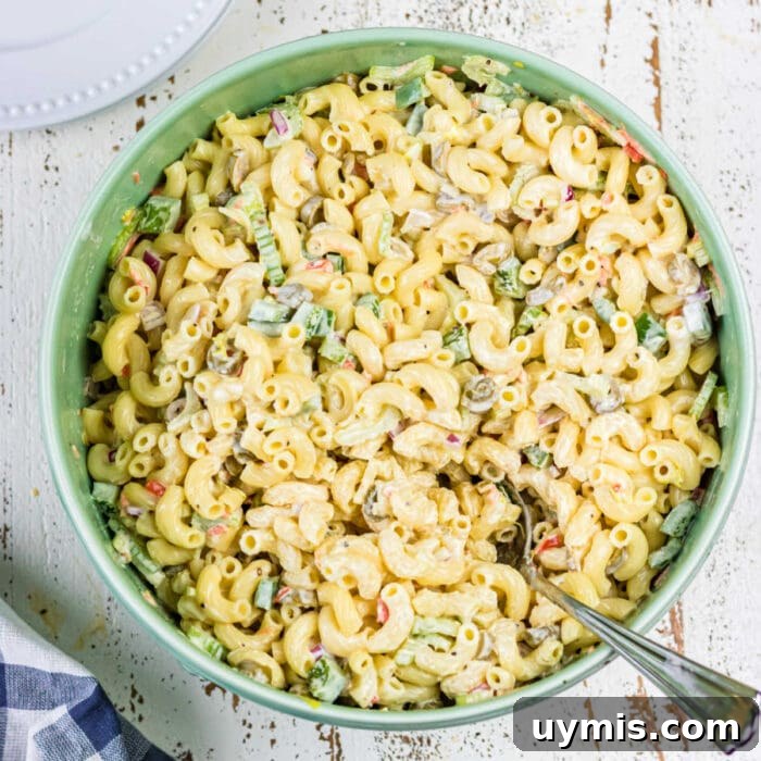 Old Fashioned Sloppy Joes Recipe 11 Over head view of macaroni salad with a spoon in it for the feature image.