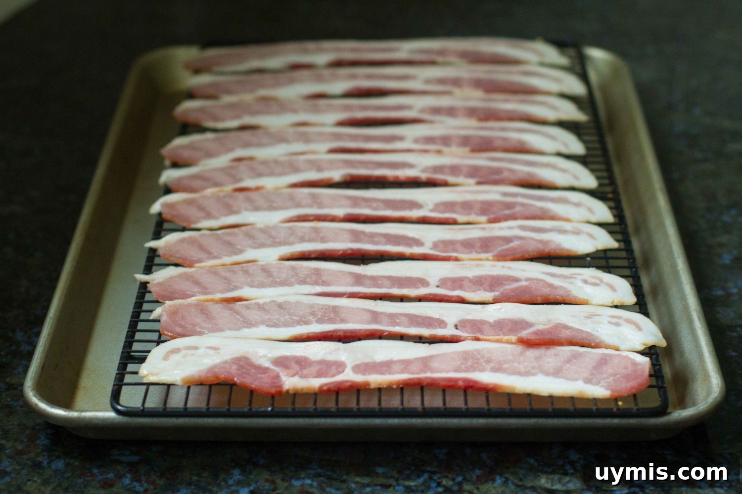 How to Bake Bacon in the Oven for Crispy, Even Slices 8 baked bacon on pan